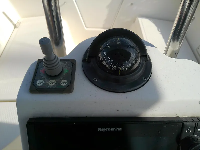 Slide: The Image of 2017 Hake Seaward 32RK boat compass and control panel close-up. - 17