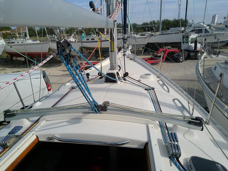 Slide: The Image of 2017 Hake Seaward 32RK sailboat deck with rigging and marina background. - 23