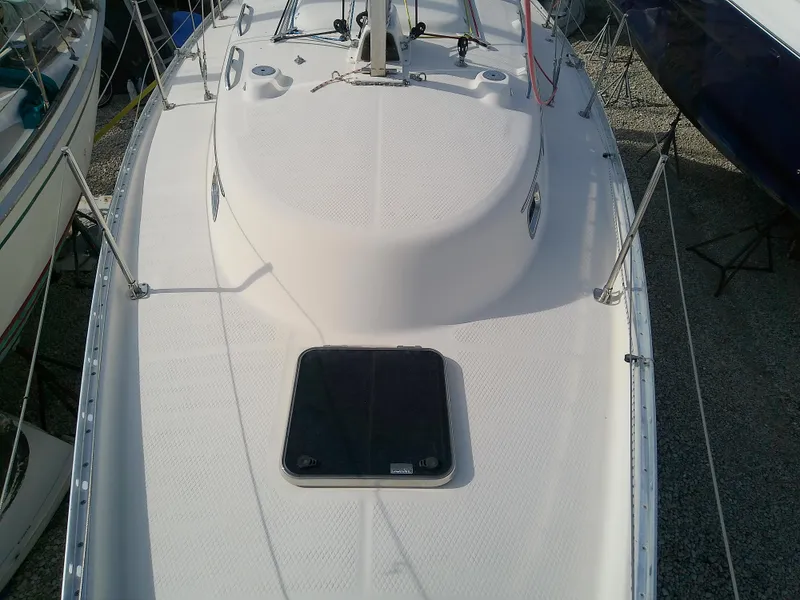 Slide: The Image of 2017 Hake Seaward 32RK sailboat deck view, featuring sleek design and hatch. - 26