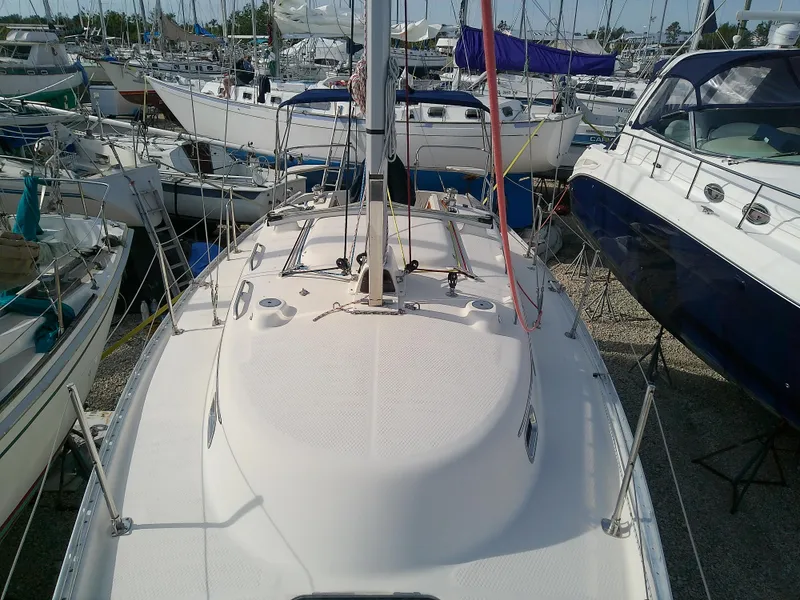 Slide: The Image of 2017 Hake Seaward 32RK sailboat docked among other boats. - 27