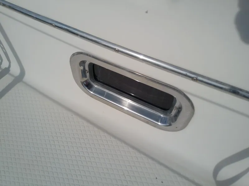 Slide: The Image of Close-up of a 2017 Hake Seaward 32RK boat porthole with chrome trim. - 29