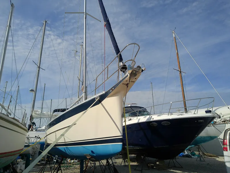 Slide: The Image of 2017 Hake Seaward 32RK sailboat on dry dock, surrounded by other boats. - 3
