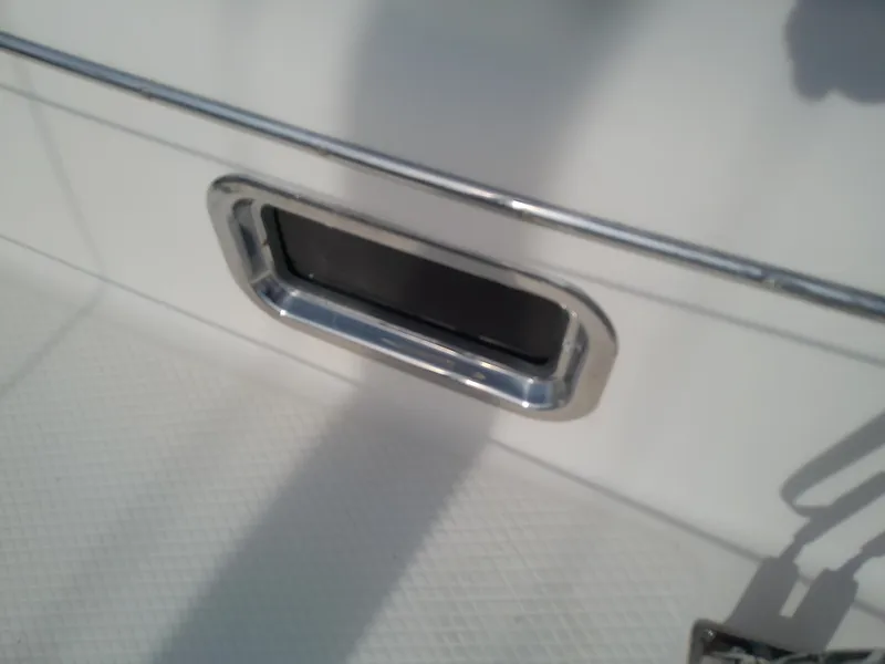 Slide: The Image of Close-up of a 2017 Hake Seaward 32RK boat detail with chrome trim. - 30