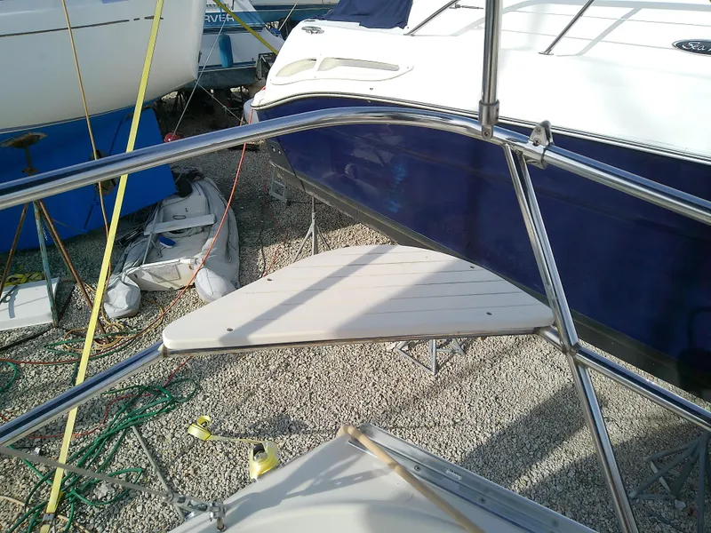 Slide: The Image of 2017 Hake Seaward 32RK sailboat on gravel, surrounded by other boats. - 46