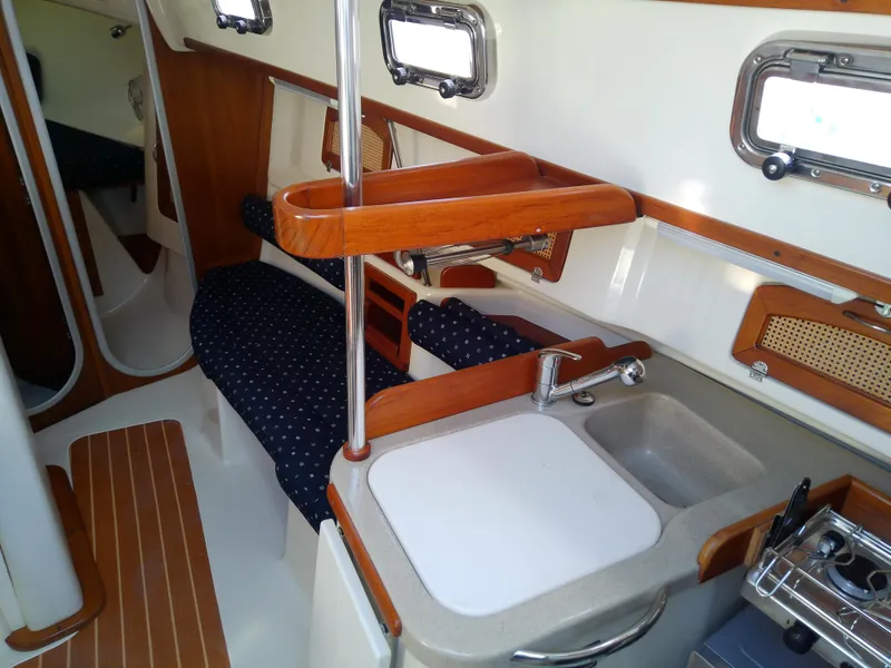 Slide: The Image of Interior of 2017 Hake Seaward 32RK sailboat with compact kitchen and seating area. - 47