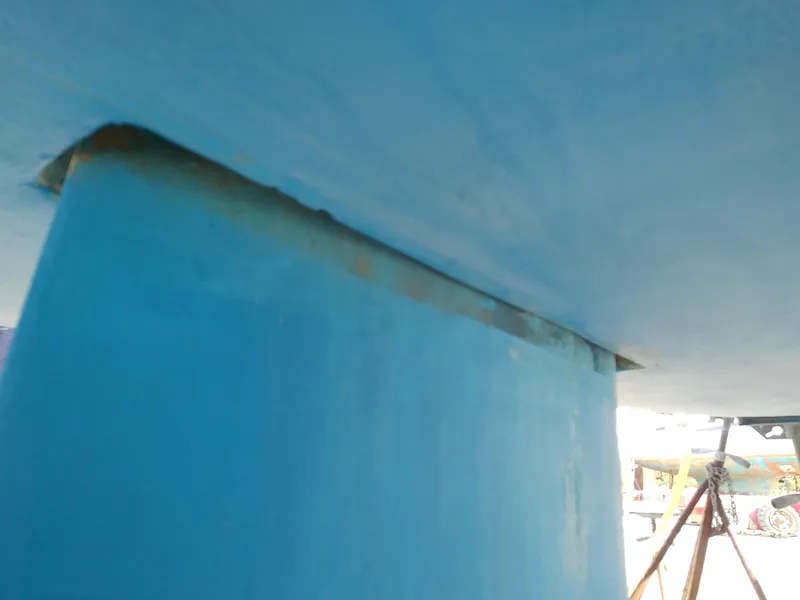 Slide: The Image of 2017 Hake Seaward 32RK sailboat keel detail, blue hull, dry docked. - 9