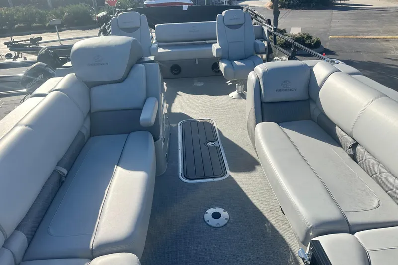 Slide: The Image of 2024 Regency R230LE3 SPT boat interior with luxurious seating and modern design. - 3