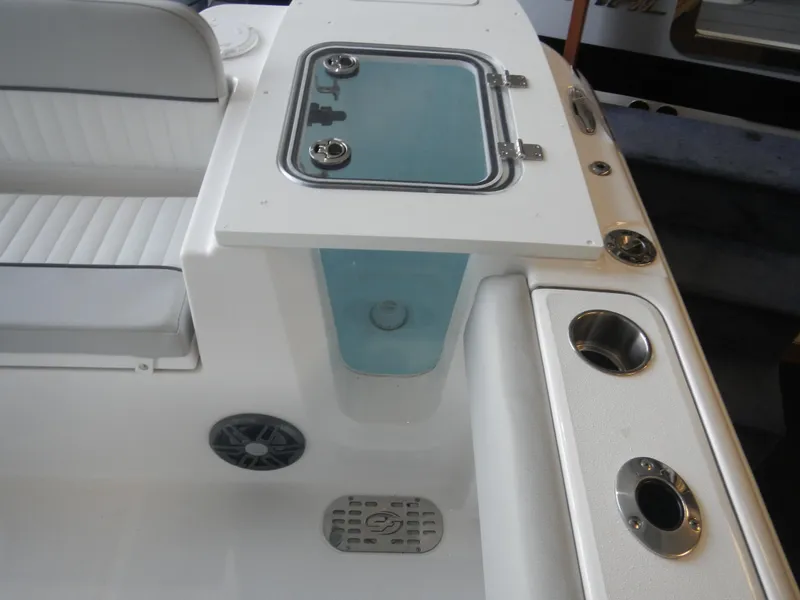 Slide: The Image of 2024 Sea Fox 228 Commander boat interior with seating and storage compartments. - 2