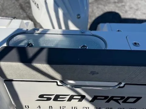 Slide: The Image of 2024 Sea Pro 240DLX boat detail with Yamaha engine in background. - 5