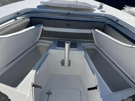 Slide: The Image of 2024 Sea Pro 240DLX boat interior with open storage compartments. - 7