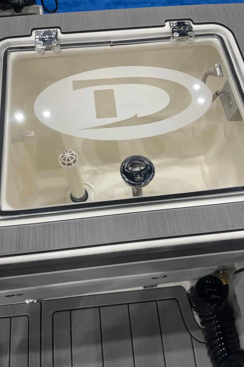 Slide: The Image of Interior cabin view of 2025 Defiance Admiral 250 EX boat, featuring seating and sleeping area. - 18