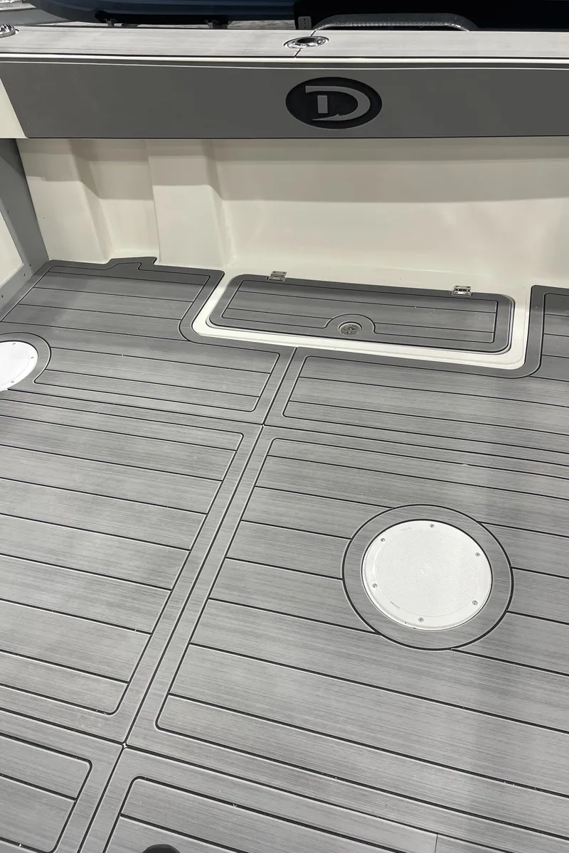 Slide: The Image of 2025 Defiance Admiral 250 EX boat interior with seating and storage compartments. - 21