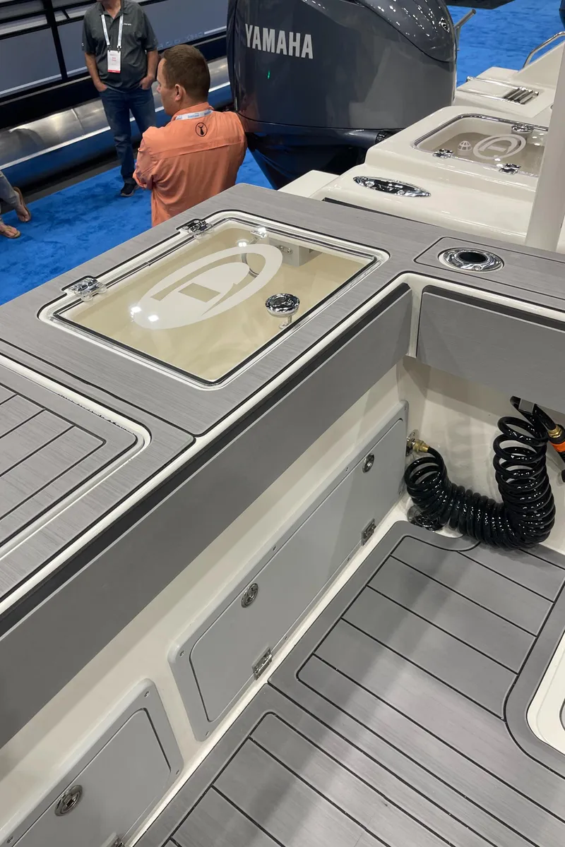 Slide: The Image of 2025 Defiance Admiral 250 EX dashboard with Garmin display and steering wheel. - 10