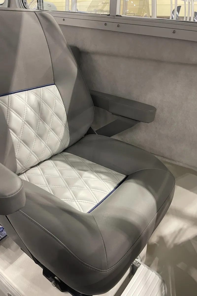 Slide: The Image of Interior of 2025 Defiance Admiral 250 EX boat with gray seating and cabin view. - 16
