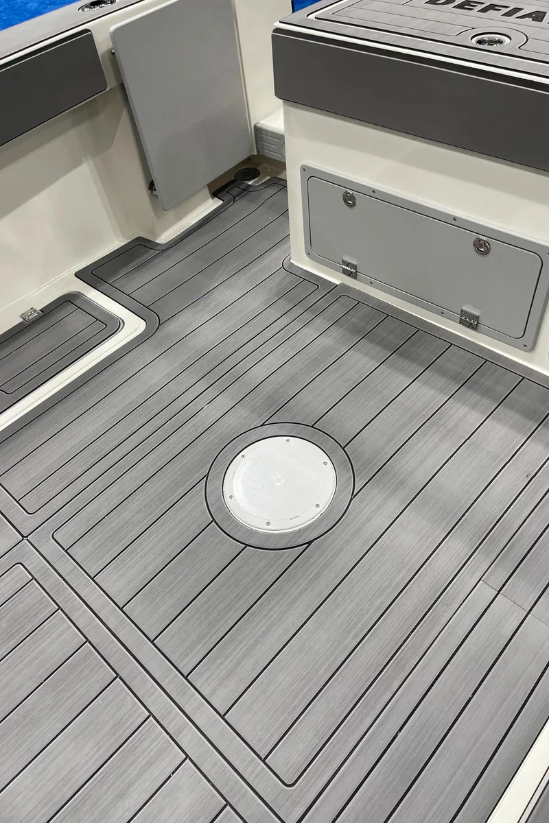 Slide: The Image of 2025 Defiance Admiral 250 EX boat with sleek design and reflective windows. - 22