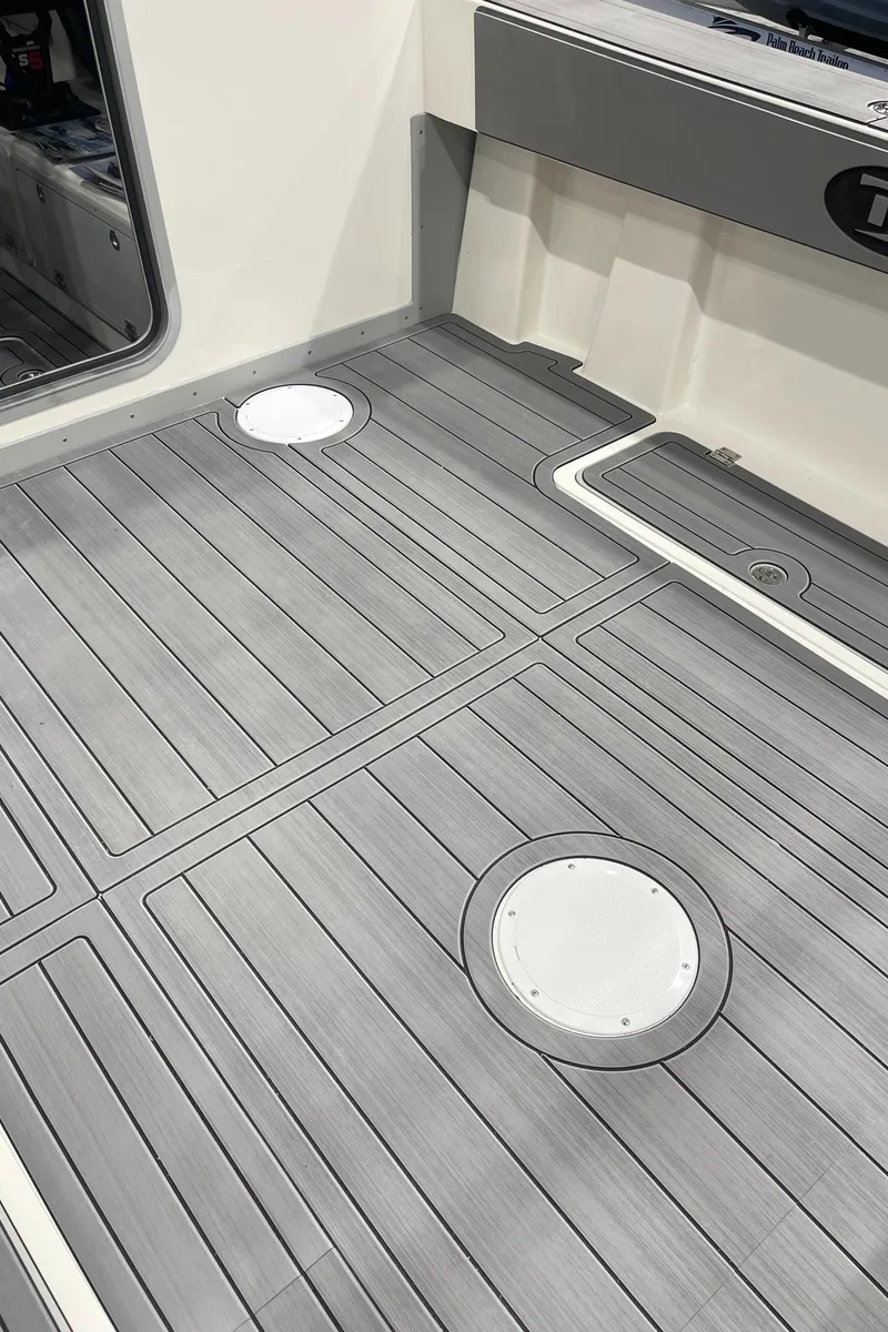 Slide: The Image of 2025 Defiance Admiral 250 EX boat with rod holders and cabin view. - 9