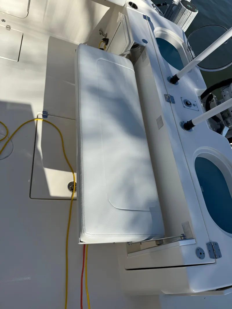 Slide: The Image of 2023 Cobia 350 Center Console boat interior with seating and storage compartments. - 27