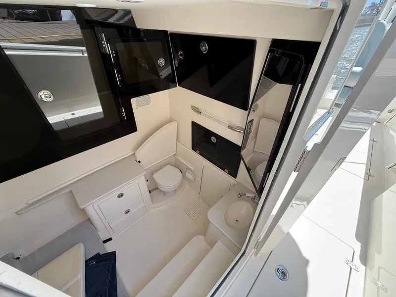 Slide: The Image of 2023 Cobia 350 Center Console boat interior with modern bathroom amenities. - 40