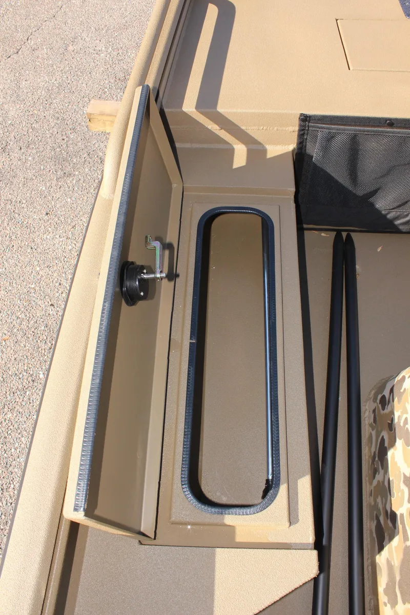 Slide: The Image of 2025 Excel 1860 F4 Shallow Water boat storage compartment with open hatch. - 16