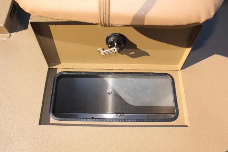 Slide: The Image of 2025 Excel 1860 F4 Shallow Water boat storage compartment with latch. - 19