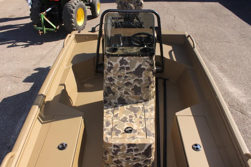 Slide: The Image of 2025 Excel 1860 F4 Shallow Water boat with camouflage console and tan interior. - 21