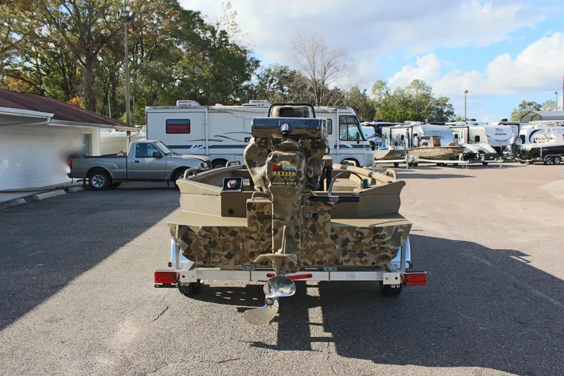 Slide: The Image of 2025 Excel 1860 F4 Shallow Water boat on trailer in parking lot. - 6