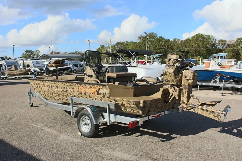 Slide: The Image of 2025 Excel 1860 F4 Shallow Water boat with camouflage design on a trailer. - 7