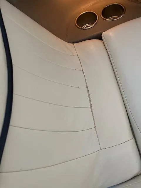 Slide: The Image of Cream leather seat in 2005 Cobalt 282 boat with cup holders. - 11