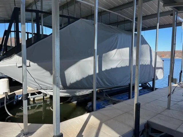 Slide: The Image of Covered 2005 Cobalt 282 boat docked in a sheltered marina. - 14