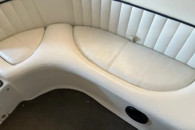 Slide: The Image of 2005 Cobalt 282 boat interior with white leather seating and black trim. - 17