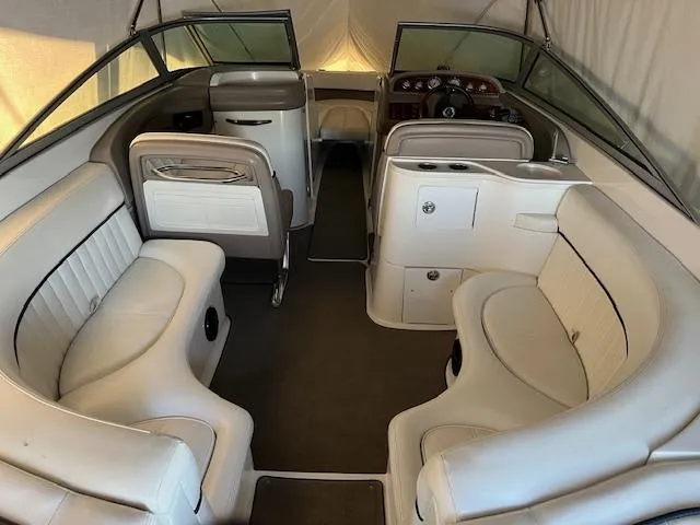 Slide: The Image of 2005 Cobalt 282 boat interior with white seating and sleek design. - 3