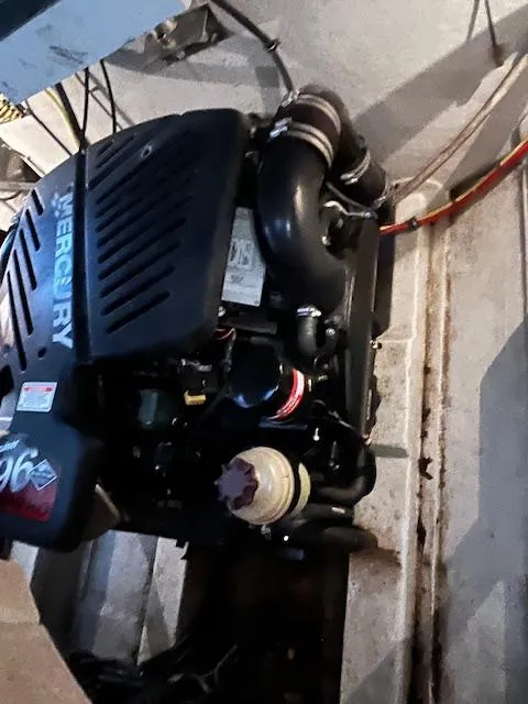 Slide: The Image of 2005 Cobalt 282 boat engine, Mercury 496, in engine compartment. - 6