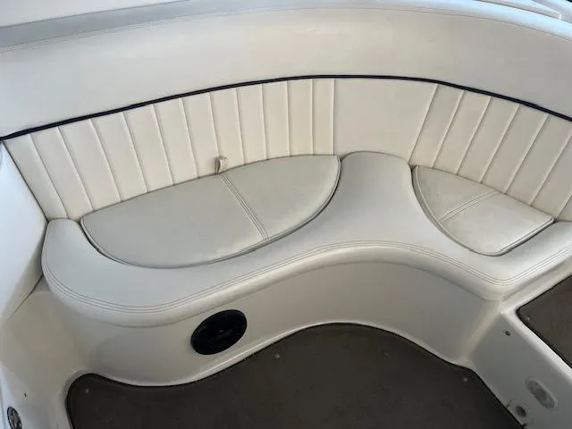 Slide: The Image of White leather seating in a 2005 Cobalt 282 boat interior. - 9