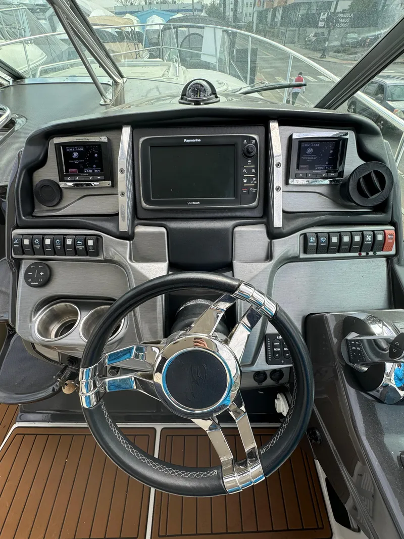 Slide: The Image of Cockpit of 2014 Monterey 340 Sport Yacht with modern navigation controls and steering wheel. - 10
