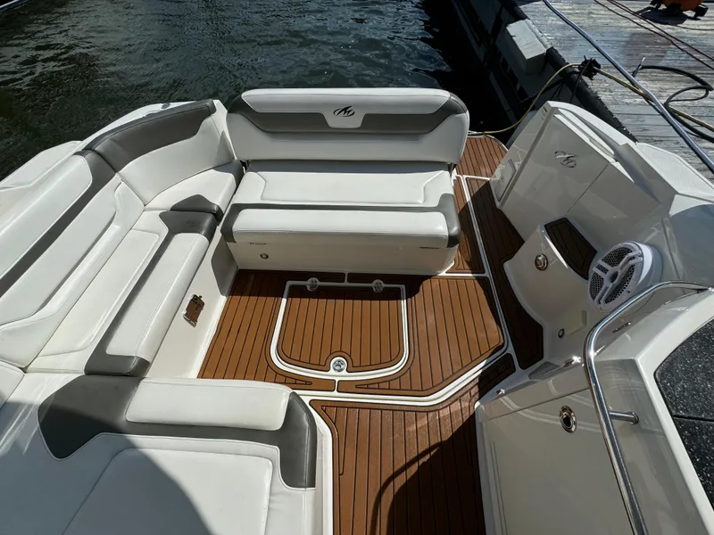 Slide: The Image of 2014 Monterey 340 Sport Yacht interior with white seating and teak flooring. - 6