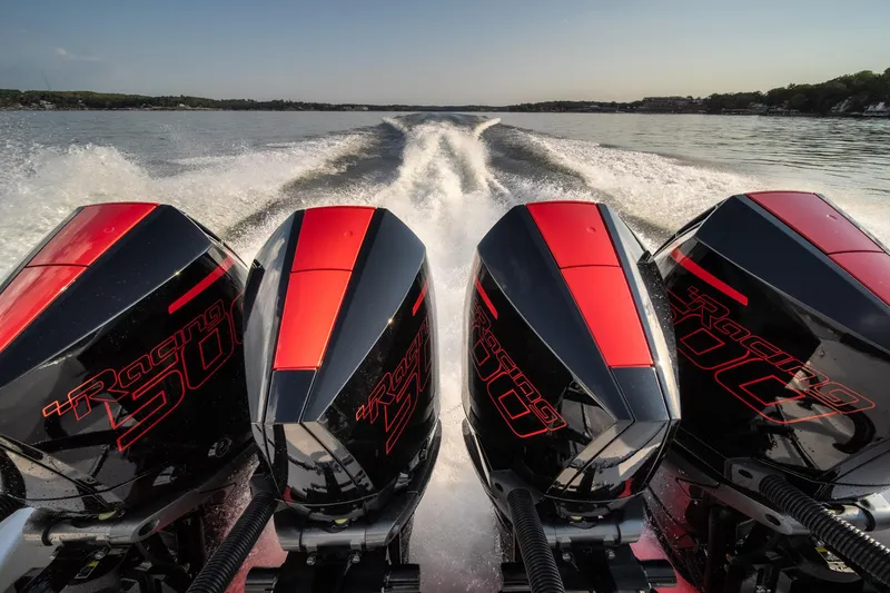 Slide: The Image of 2024 Fountain 43SCX boat with four powerful outboard engines on the water. - 13