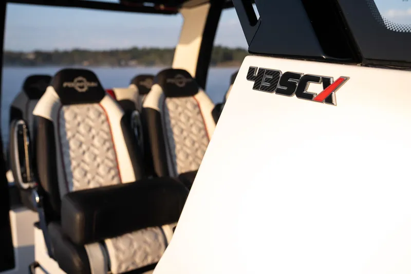 Slide: The Image of 2024 Fountain 43SCX boat interior with luxury seating and logo detail. - 17