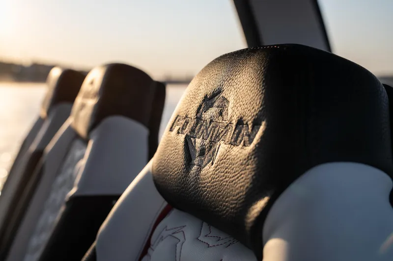 Slide: The Image of 2024 Fountain 43SCX boat seat with embossed logo, sunset view. - 22