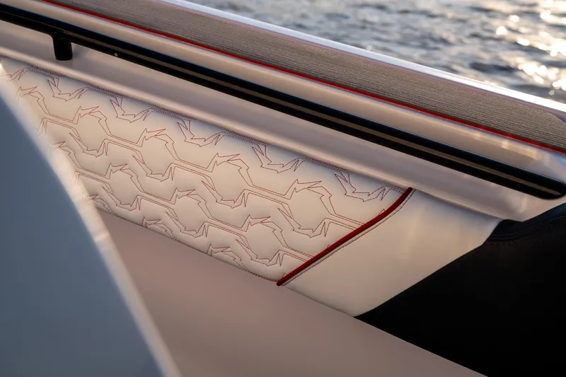 Slide: The Image of 2024 Fountain 43SCX boat interior with elegant white and red stitching detail. - 24