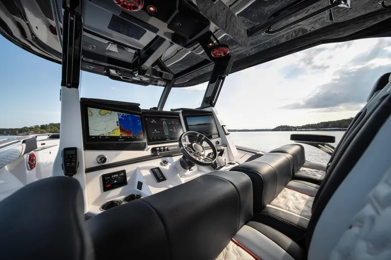 Slide: The Image of 2024 Fountain 43SCX boat interior with advanced navigation systems and luxurious seating. - 27