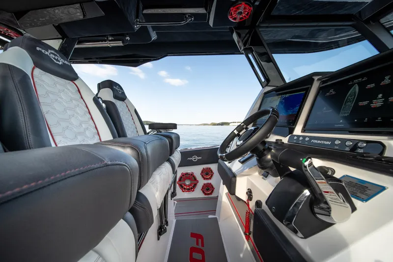 Slide: The Image of 2024 Fountain 43SCX boat interior with modern dashboard and luxurious seating. - 29