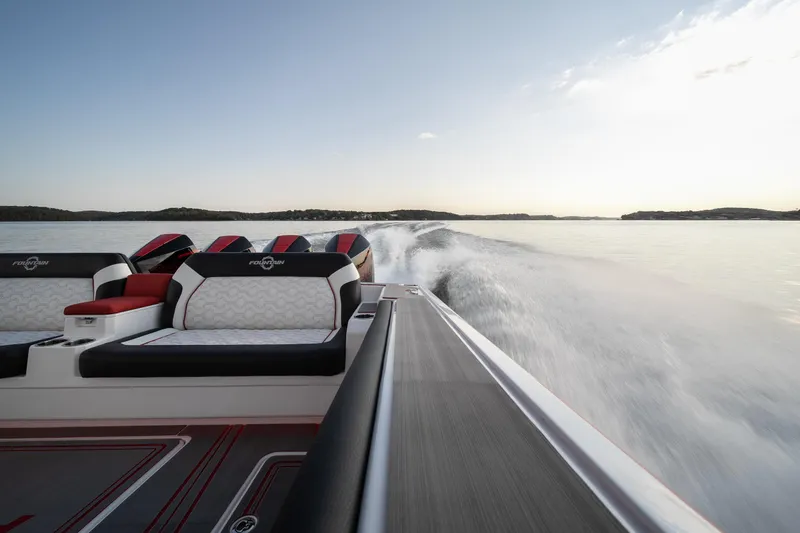 Slide: The Image of 2024 Fountain 43SCX speedboat cruising on open water at sunset. - 31