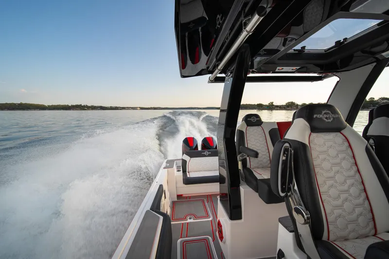 Slide: The Image of 2024 Fountain 43SCX boat interior with luxurious seating on open water. - 33