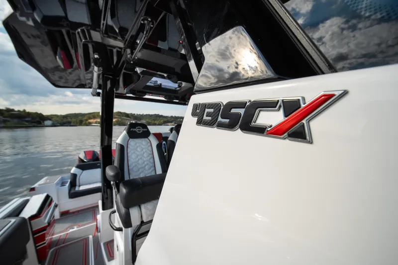 Slide: The Image of 2024 Fountain 43SCX boat interior with logo, featuring sleek design and comfortable seating. - 46