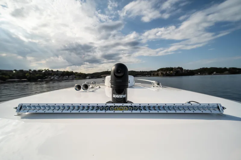 Slide: The Image of 2024 Fountain 43SCX boat with Seaview camera on deck, under a partly cloudy sky. - 48