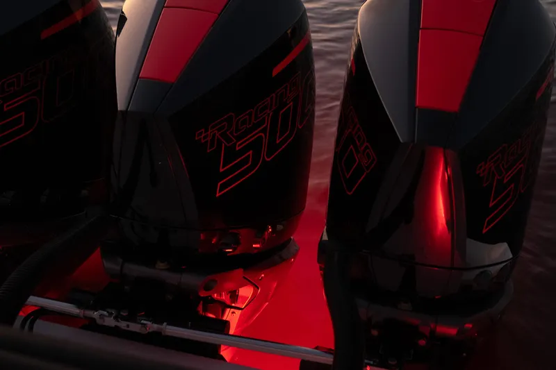 Slide: The Image of Close-up of 2024 Fountain 43SCX boat engines with red lighting. - 65