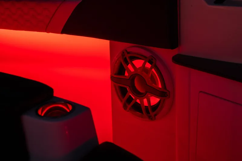 Slide: The Image of 2024 Fountain 43SCX boat interior with red ambient lighting and speaker detail. - 68