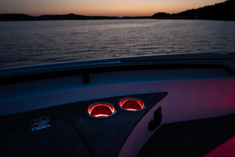 Slide: The Image of 2024 Fountain 43SCX boat interior with illuminated cup holders at sunset. - 69