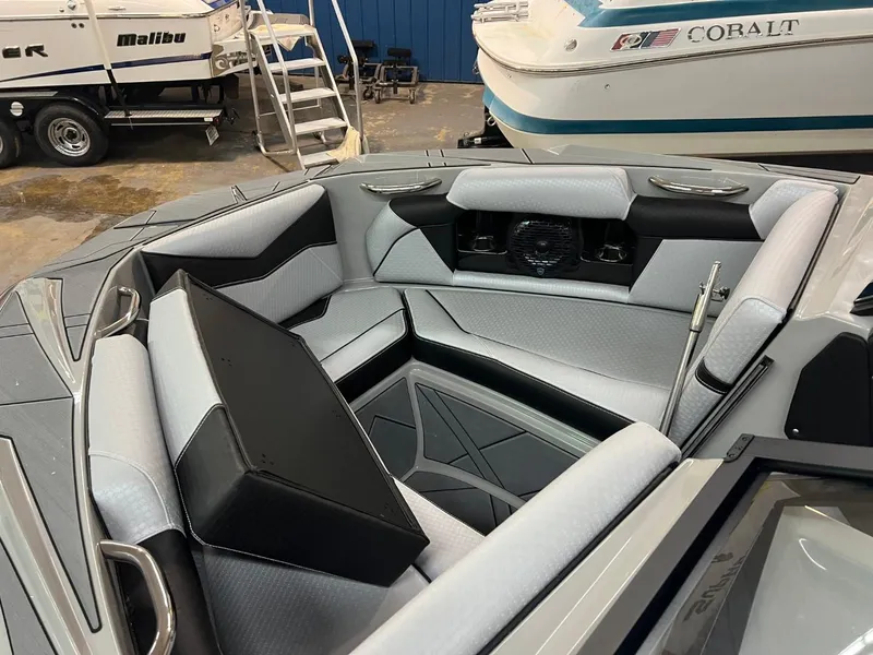 Slide: The Image of 2024 Supreme S220 boat interior with modern seating and sleek design. - 18