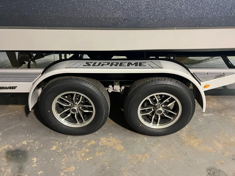 Slide: The Image of 2024 Supreme S220 trailer with dual wheels and branded fender. - 23